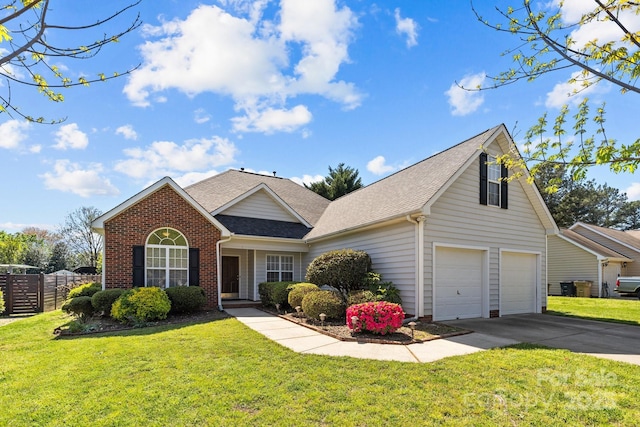 view of front facade with fence, a front lawn, brick siding, a shingled roof, and concrete driveway