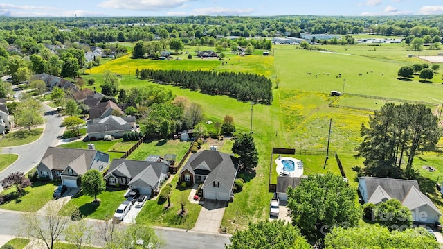 birds eye view of property featuring a residential view and a rural view