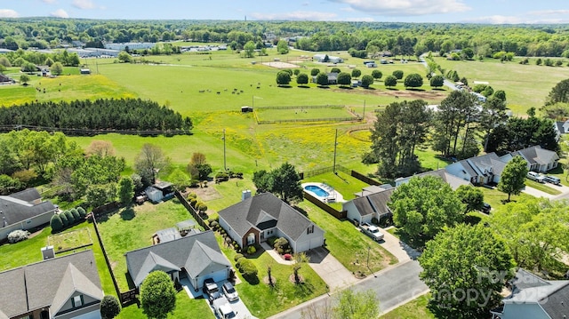 birds eye view of property with a rural view and a residential view