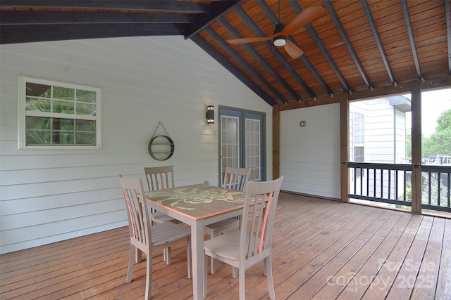 wooden terrace with outdoor dining space and ceiling fan
