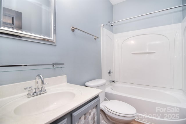 full bathroom featuring shower / washtub combination, vanity, and toilet