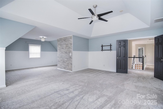 additional living space featuring vaulted ceiling, a ceiling fan, visible vents, and carpet