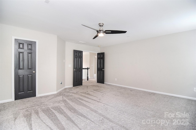 unfurnished bedroom featuring visible vents, baseboards, and light colored carpet