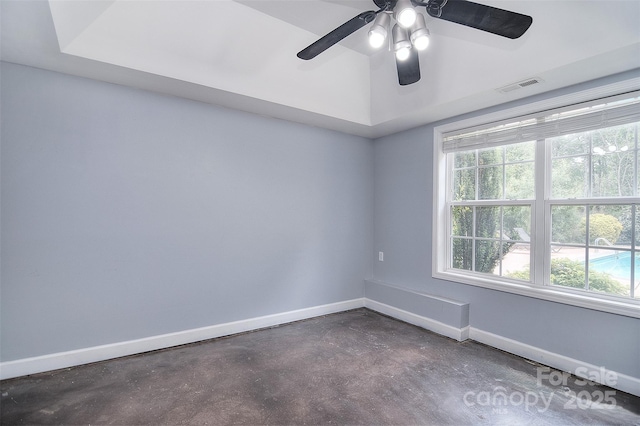 unfurnished room featuring baseboards, visible vents, and plenty of natural light