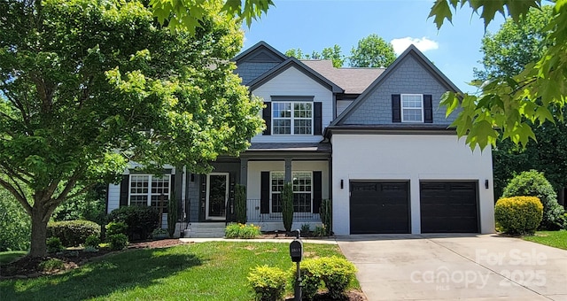 1811 Robbins Meadows Dr, Waxhaw, NC 28173 - view of front of home with driveway, covered porch, an attached garage, and a front yard