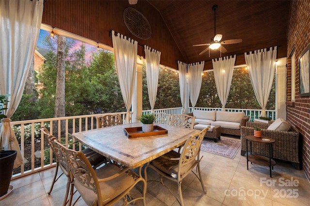 view of patio featuring an outdoor living space, a ceiling fan, and outdoor dining space