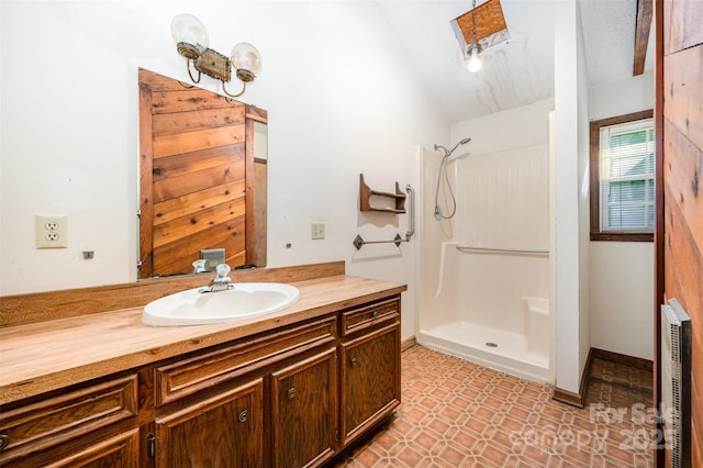2415 Hargette Rd, Monroe, NC 28112 - full bathroom featuring tile patterned floors, vanity, vaulted ceiling, and walk in shower