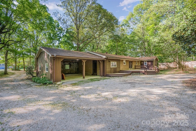 2415 Hargette Rd, Monroe, NC 28112 - view of front of house with a carport and a wooden deck