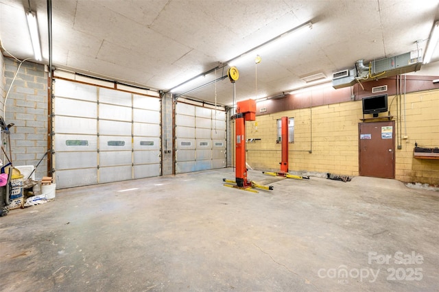 2415 Hargette Rd, Monroe, NC 28112 - garage with concrete block wall