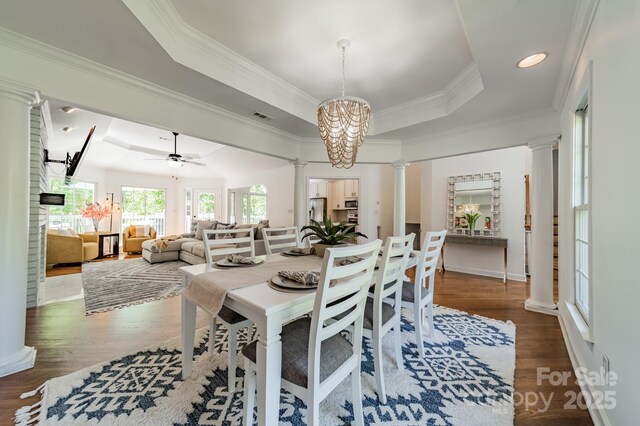 108 Tall Oak Dr, Mooresville, NC 28117 - dining space with ornamental molding, visible vents, decorative columns, and a raised ceiling