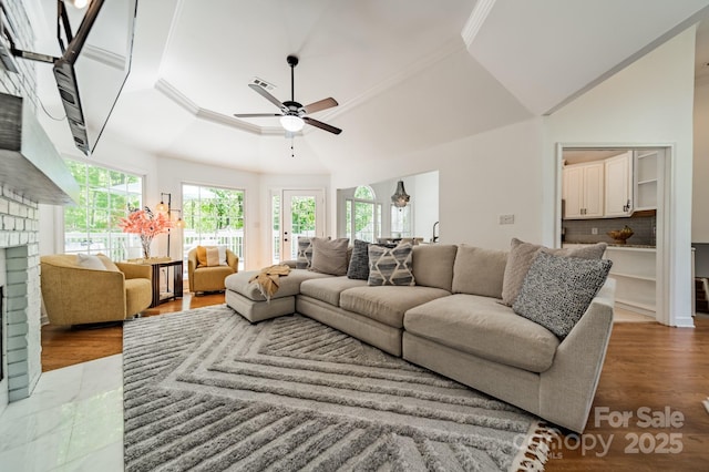 108 Tall Oak Dr, Mooresville, NC 28117 - living area with crown molding, ceiling fan, wood finished floors, and a brick fireplace