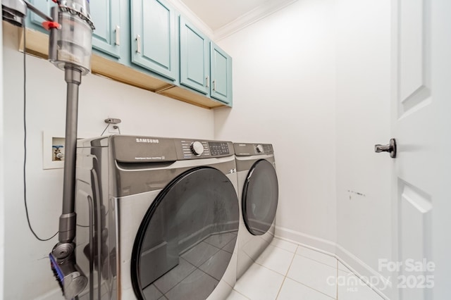 108 Tall Oak Dr, Mooresville, NC 28117 - clothes washing area with cabinet space, ornamental molding, washing machine and clothes dryer, and light tile patterned floors