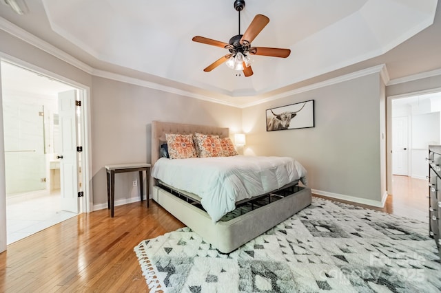 108 Tall Oak Dr, Mooresville, NC 28117 - bedroom with wood-type flooring, baseboards, ornamental molding, and a raised ceiling