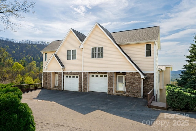 116 Dalya Rd, Swannanoa, NC 28778 - view of front facade with driveway, an attached garage, and stone siding