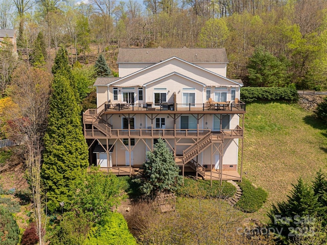 116 Dalya Rd, Swannanoa, NC 28778 - back of property with a wooden deck, stairway, and a lawn