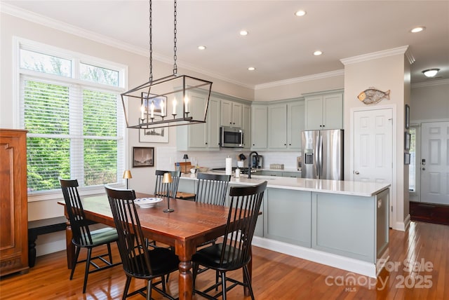 116 Dalya Rd, Swannanoa, NC 28778 - dining space featuring plenty of natural light, a chandelier, crown molding, light wood-style floors, and recessed lighting