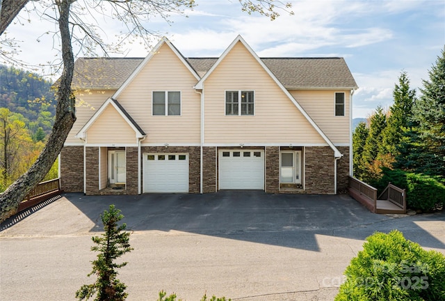 116 Dalya Rd, Swannanoa, NC 28778 - view of front of house featuring driveway, stone siding, and a garage