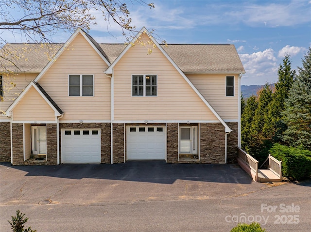 116 Dalya Rd, Swannanoa, NC 28778 - view of front of home featuring driveway, stone siding, a garage, and a shingled roof