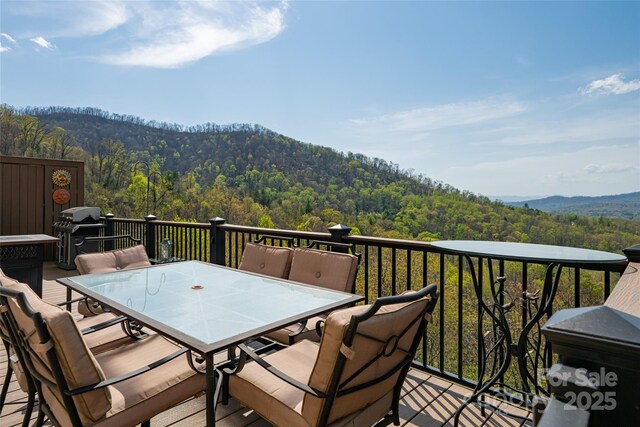 116 Dalya Rd, Swannanoa, NC 28778 - wooden deck featuring a forest view, outdoor dining area, grilling area, and a mountain view