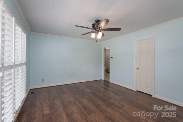 unfurnished room featuring ceiling fan, dark wood-style flooring, crown molding, and baseboards