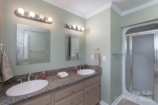 full bath with crown molding, a shower stall, and double vanity