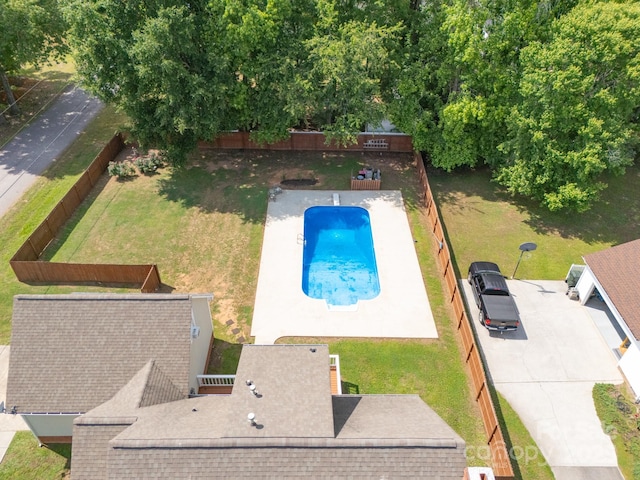 view of subject property featuring a pool