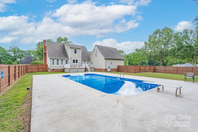 view of pool featuring a wooden deck and a patio