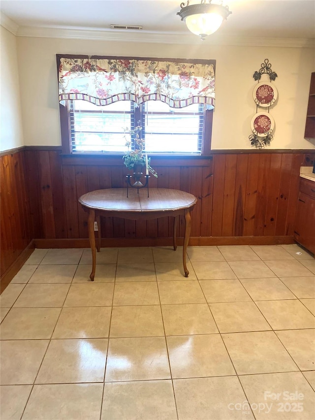 1410 Delwood Dr SW, Lenoir, NC 28645 - dining area with plenty of natural light, light tile patterned floors, and a wainscoted wall