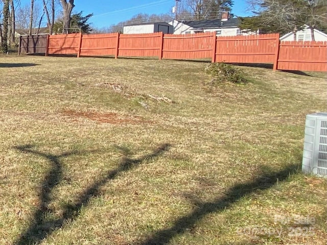 1410 Delwood Dr SW, Lenoir, NC 28645 - view of yard with central AC and fence