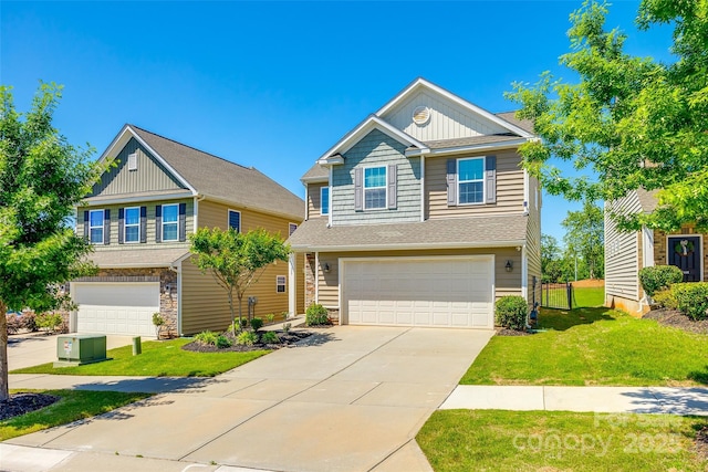 traditional-style house featuring a garage, board and batten siding, driveway, and a front yard