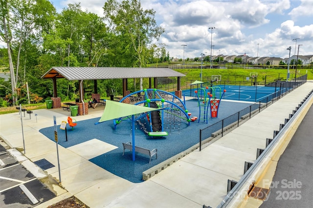 community playground featuring fence and community basketball court