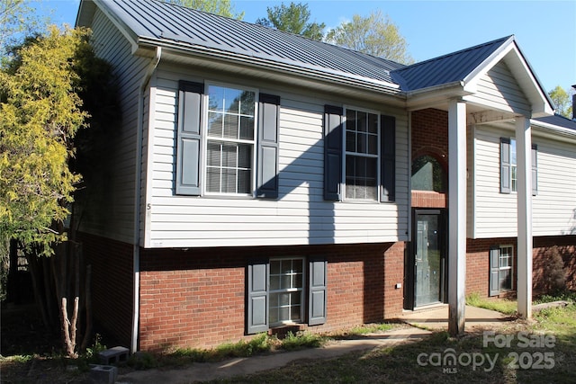 5164 Ralph Winchester Rd, Lenoir, NC 28645 - view of side of property with brick siding, metal roof, and a standing seam roof
