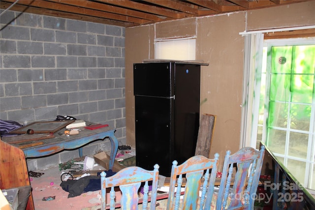 5164 Ralph Winchester Rd, Lenoir, NC 28645 - kitchen featuring freestanding refrigerator and concrete block wall
