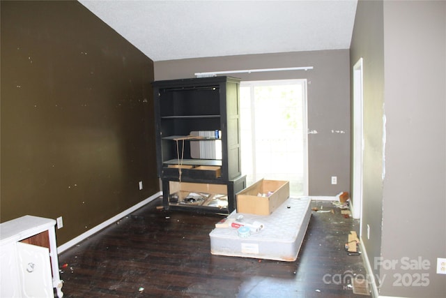 5164 Ralph Winchester Rd, Lenoir, NC 28645 - living room featuring baseboards, wood finished floors, and lofted ceiling