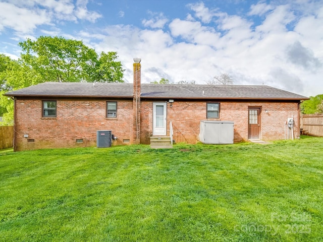 1315 Holshouser Rd, Rockwell, NC 28138 - rear view of house featuring entry steps, a lawn, crawl space, fence, and cooling unit