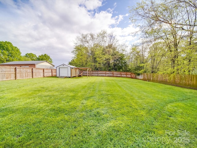 1315 Holshouser Rd, Rockwell, NC 28138 - view of yard with a storage shed, a fenced backyard, and an outdoor structure