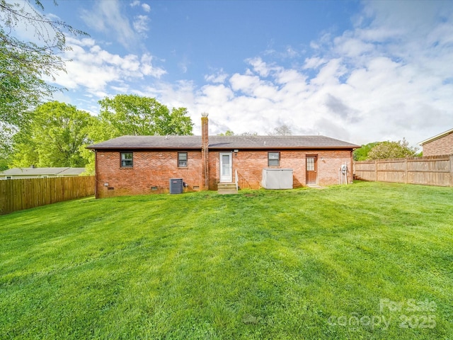 1315 Holshouser Rd, Rockwell, NC 28138 - rear view of house with central AC unit, a fenced backyard, a lawn, and crawl space