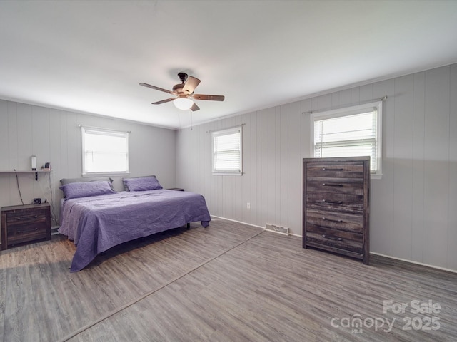 1315 Holshouser Rd, Rockwell, NC 28138 - bedroom with a ceiling fan, wood finished floors, multiple windows, and visible vents