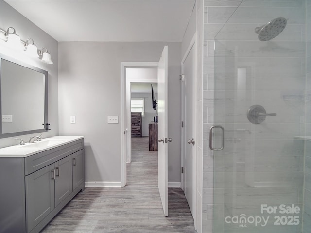 1315 Holshouser Rd, Rockwell, NC 28138 - full bath with vanity, baseboards, a stall shower, and wood finished floors