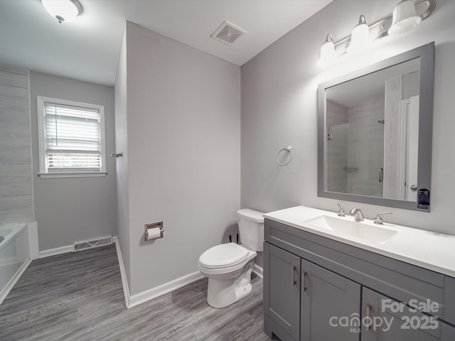 1315 Holshouser Rd, Rockwell, NC 28138 - bathroom with baseboards, walk in shower, toilet, visible vents, and wood finished floors