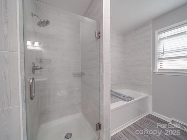 1315 Holshouser Rd, Rockwell, NC 28138 - full bath with a shower stall, a garden tub, and wood finished floors