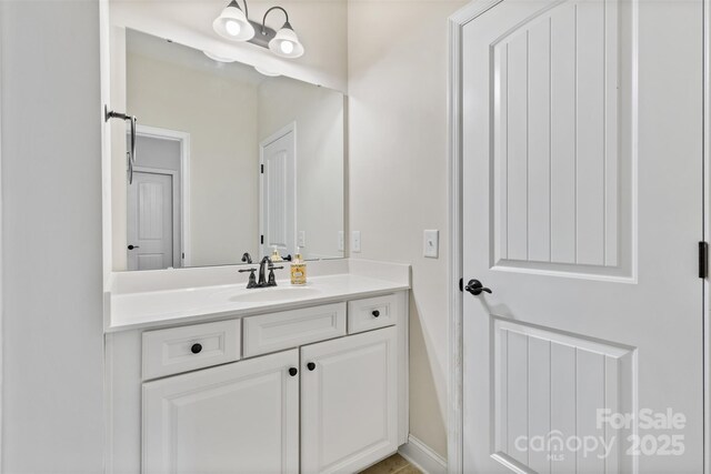 bathroom featuring vanity and baseboards