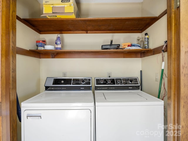 washroom with washing machine and clothes dryer