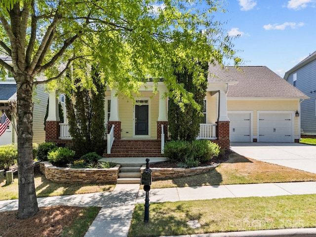 view of front facade with a garage, brick siding, concrete driveway, and a shingled roof