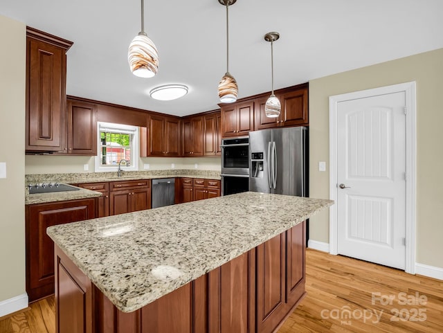 575 Hill Rd, Lincolnton, NC 28092 - kitchen with baseboards, a sink, light wood-style flooring, and stainless steel appliances