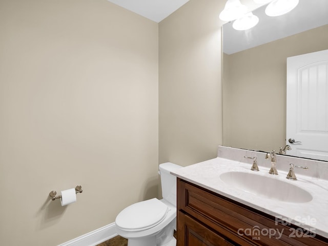 575 Hill Rd, Lincolnton, NC 28092 - bathroom with toilet, baseboards, and vanity