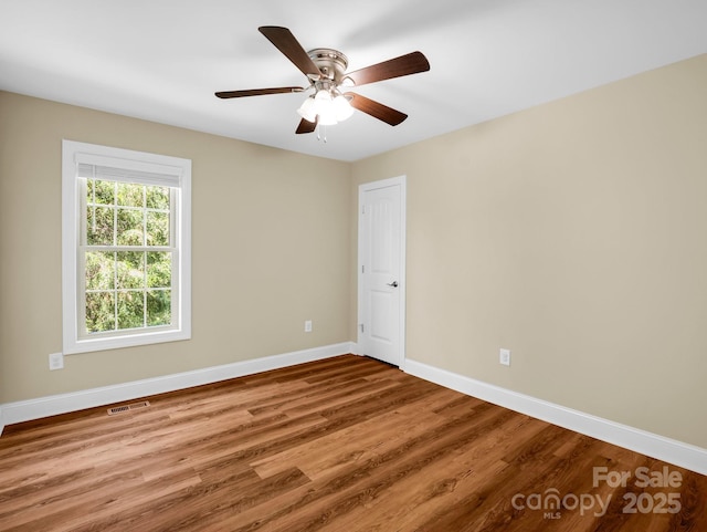 575 Hill Rd, Lincolnton, NC 28092 - empty room with baseboards, ceiling fan, wood finished floors, and visible vents