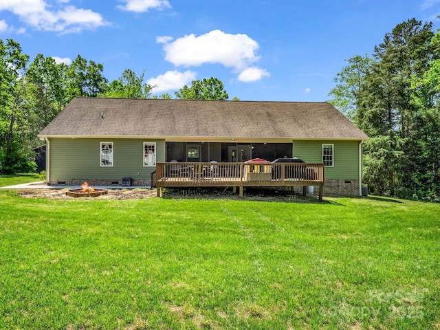 575 Hill Rd, Lincolnton, NC 28092 - rear view of house featuring roof with shingles, a deck, crawl space, a yard, and a fire pit