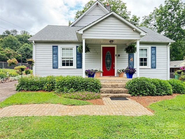 112 11th St NE, Hildebran, NC 28637 - bungalow with a shingled roof, a porch, and a front yard
