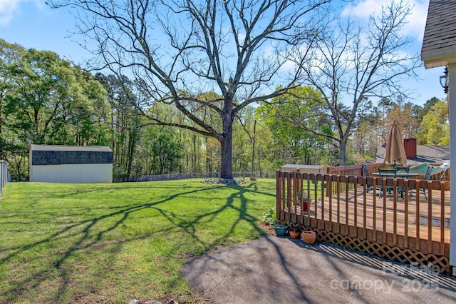 112 11th St NE, Hildebran, NC 28637 - fenced backyard featuring a storage shed and a deck